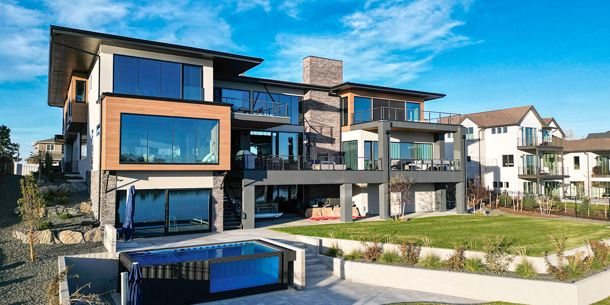 A real luxury home in Lakewood, Colorado with expansive windows and a sunny backyard